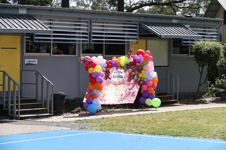 Image of poster with balloons outside the school library