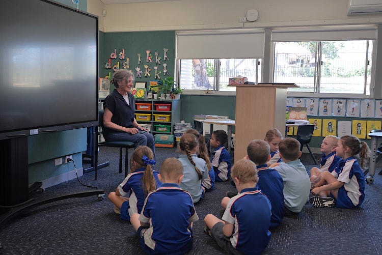Image of inside a classroom with teacher and students