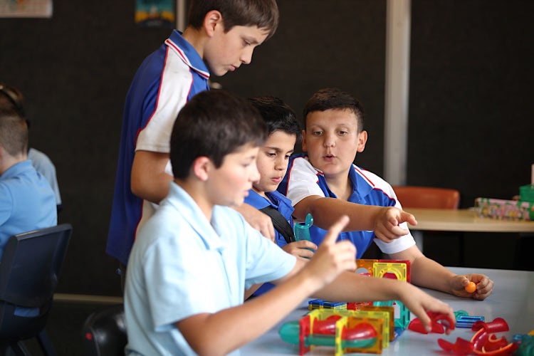 image of students working together to create a solution