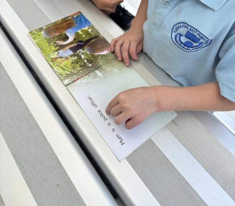 Image of a student learning to read