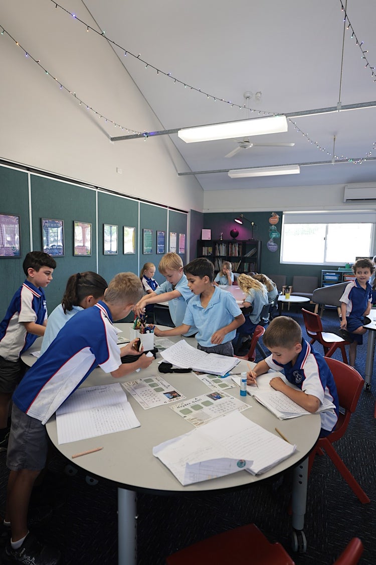 Image of students inside a classroom working