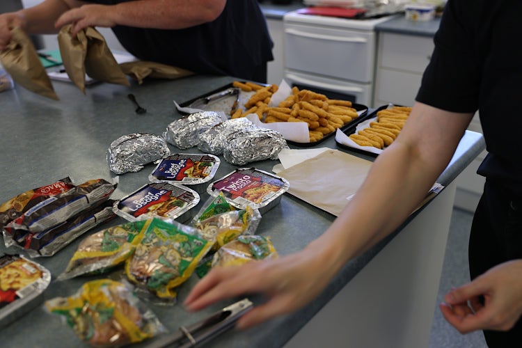 Photo showing some canteen menu items including beef lasagne, chicken goujons, and party meat pies
