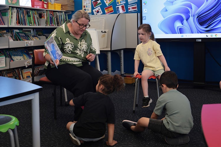 Image of our principal with children